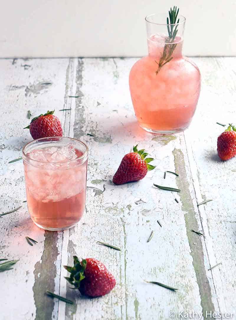 Instant Pot Strawberry Rosemary Infused Water in an etched glass pitcher