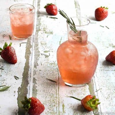 Instant Pot Strawberry Rosemary Infused Water in an etched glass pitcher