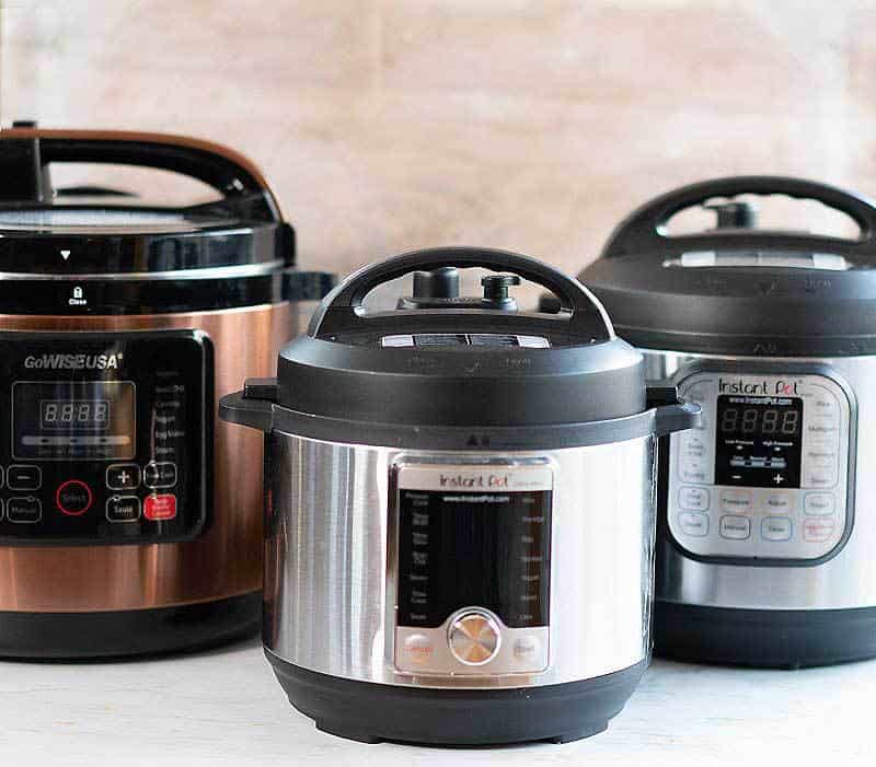 Photo of the GoWise 8 quart electric pressure cooker, 6 quart Instant Pot DUO, and 3 quart Instant Pot Ultra