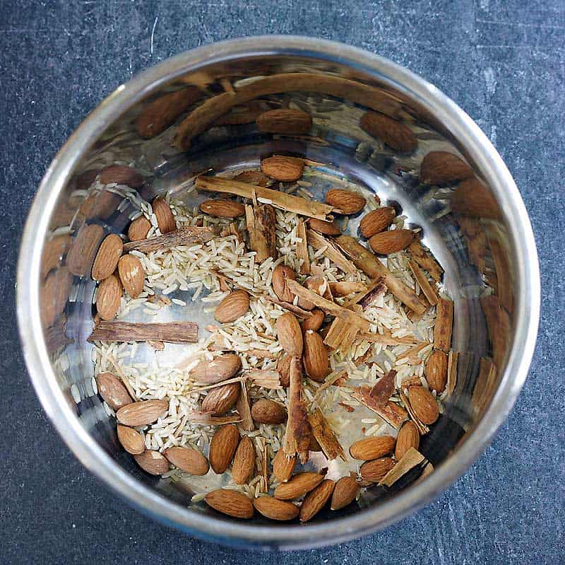 Instant pot liner with rice, almonds, and cinnamon sticks
