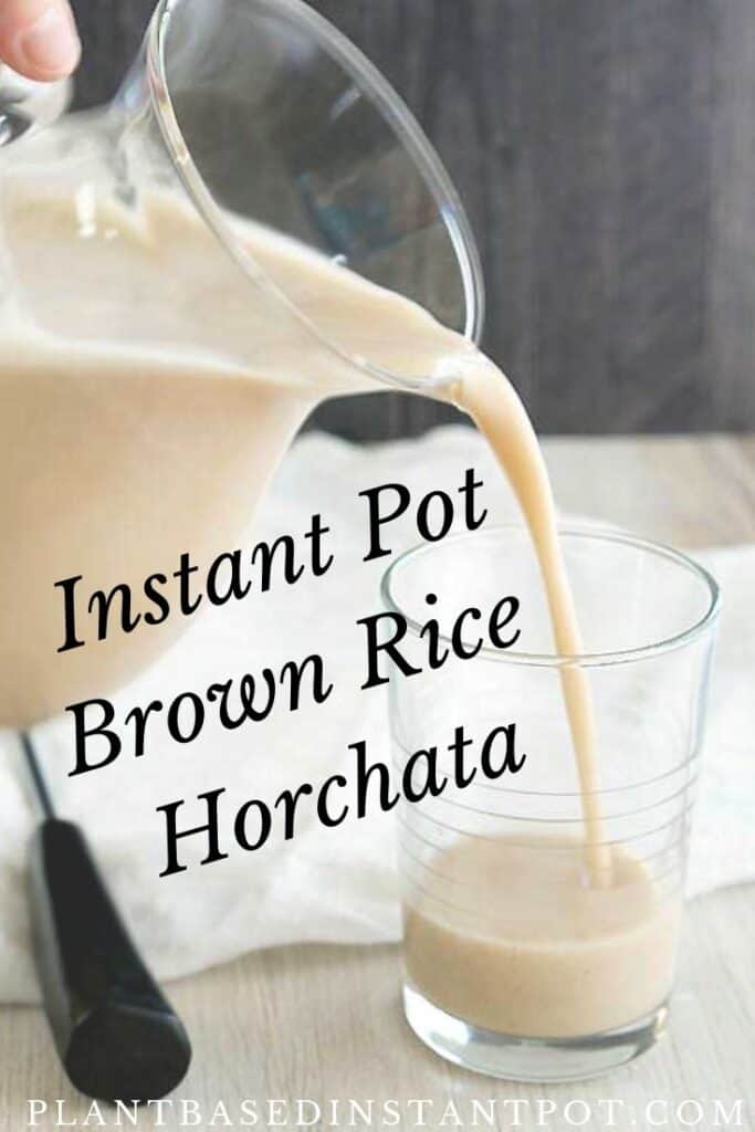 Instant Pot Brown Rice Horchata pouring out of a glass pitcher into a drinking glass.