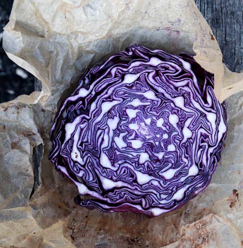 red cabbage cut in half on parchment