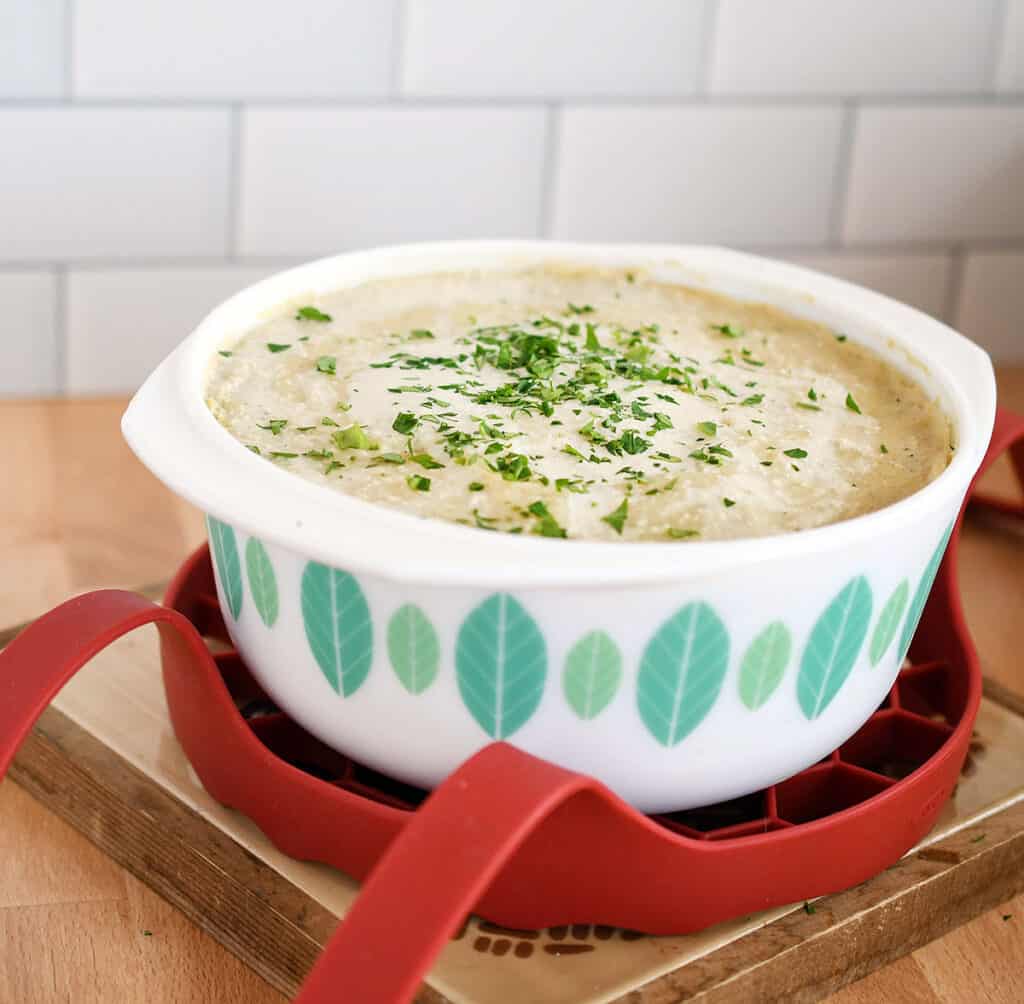 Scalloped potatoes in a reto dish in an OXO sling