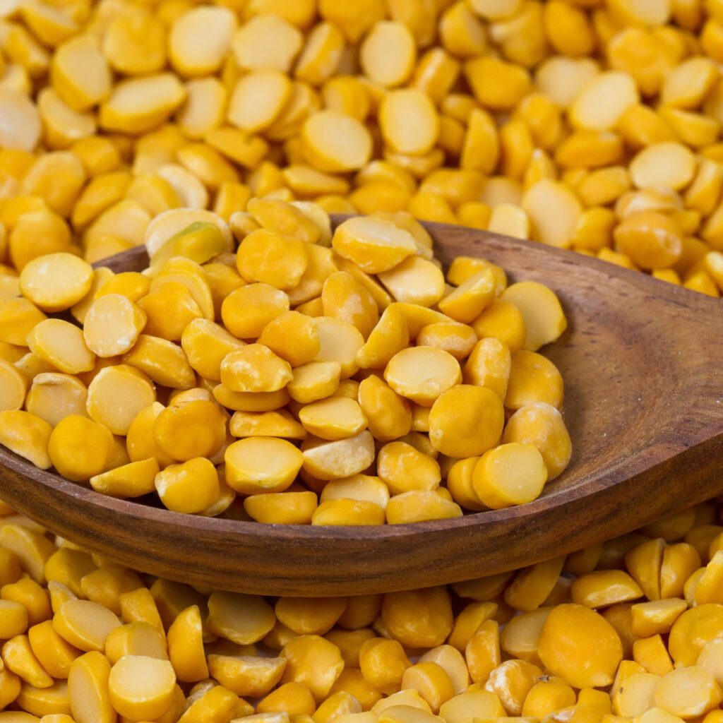 Channa dal in a wooden bowl - skinned and split baby chickpeas