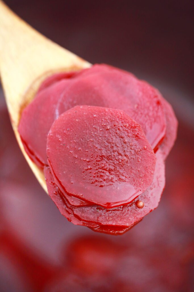 Instant Pot corned beets on a wooden spoon.