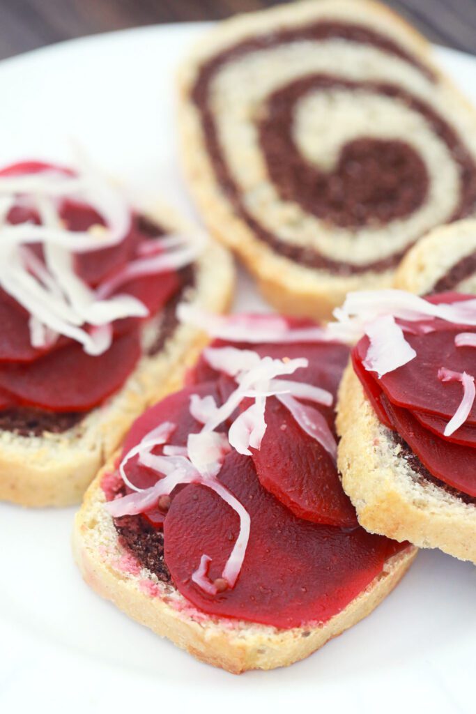 Thinnly sliced corned beets and  on rye swirl bread.